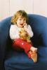 2 year old Brielle, sitting in armchair with teddy bear